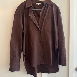 reformation will oversize shirt in cafe